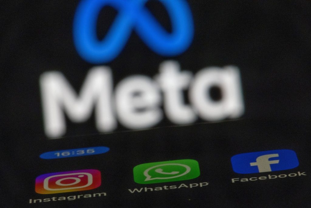 Meta to test premium subscriptions on Instagram, Facebook, and WhatsApp The apps Instagram, Facebook and WhatsApp can be seen on the display of a smartphone in front of the logo of the Meta internet company.