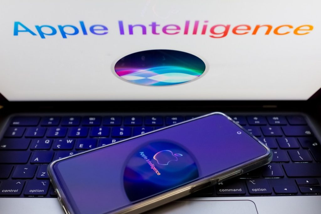 Apple plans to make Siri an AI chatbot, report says The Apple Siri and Apple Intelligence are being displayed on a smartphone screen and in the background.