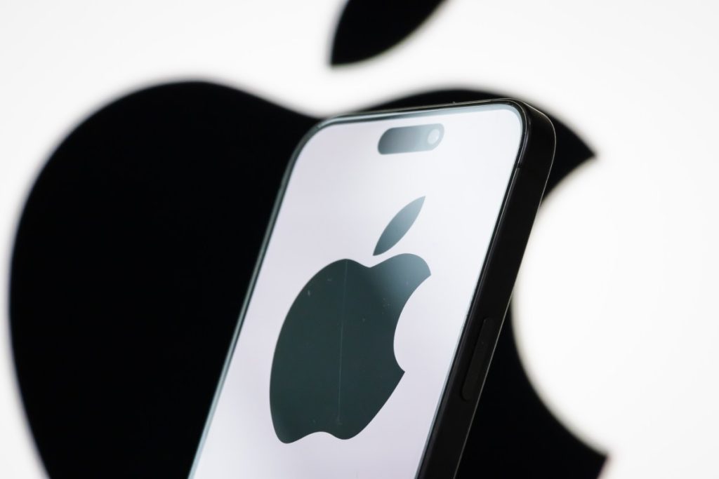 Apple’s foldable iPhone is on track to launch in September, report says In this photo illustration, the logo of Apple Inc. is displayed on a smartphone screen, with the company's iconic black apple symbol visible in the background.