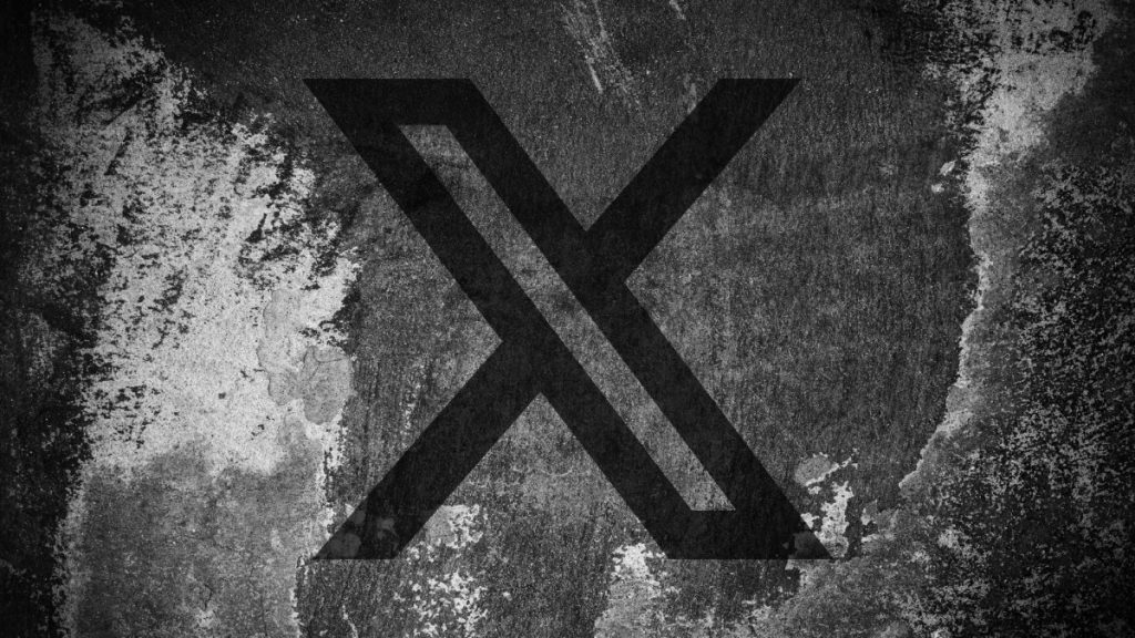 X says it will suspend creators from revenue-sharing program for unlabeled AI posts of ‘armed conflict’ X (formerly Twitter) logo on a cracked wall