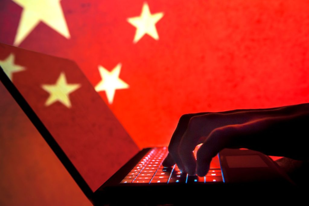 Notepad++ says Chinese government hackers hijacked its software updates for months Cybercriminal, hacker China flag background.