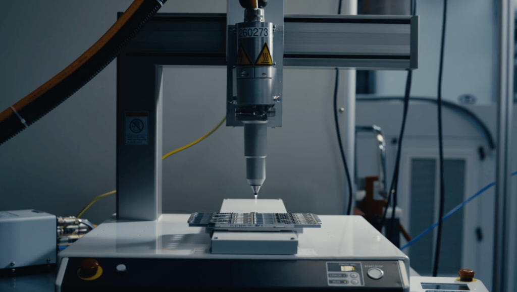 SpaceX vets raise $50M Series A for data center links An image of automated manufacturing equipment.