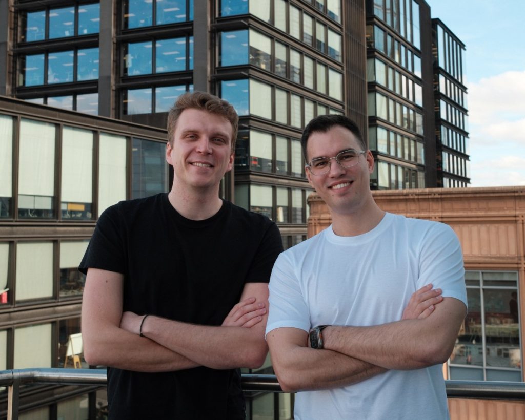 Trace raises $3M to solve the AI agent adoption problem in enterprise Two men stand on a rooftop, crossing their arms
