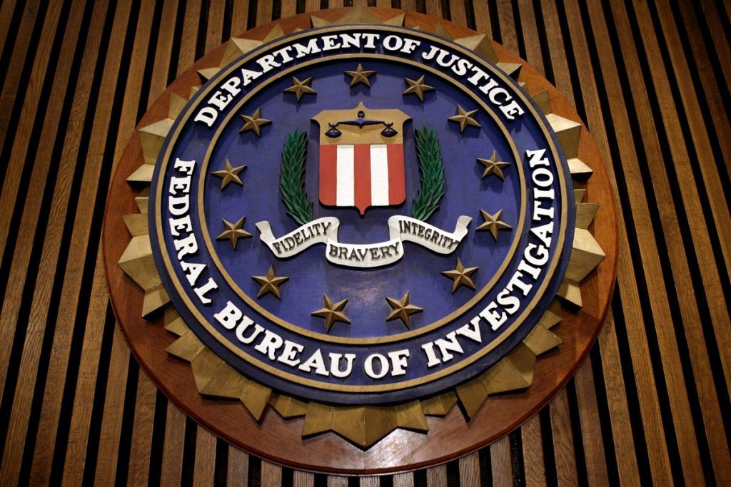 FBI investigating hack on its wiretap and surveillance systems: report The seal of the F.B.I. hangs in the Flag Room at the bureau's headquaters March 9, 2007 in Washington, DC.