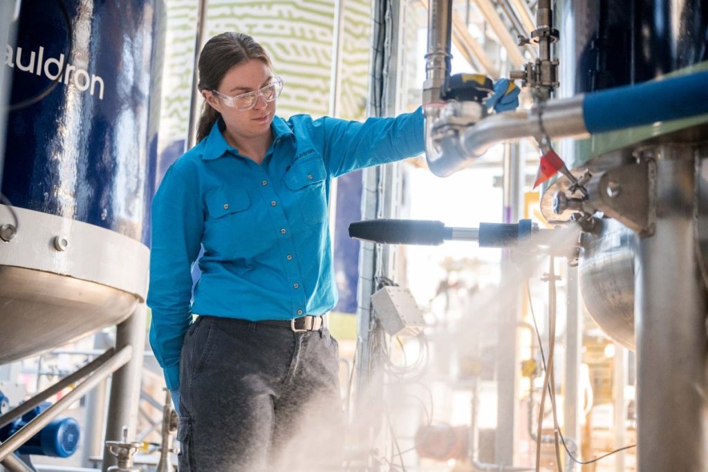 Cauldron Ferm has turned microbes into nonstop assembly lines A woman operates a fermenter.