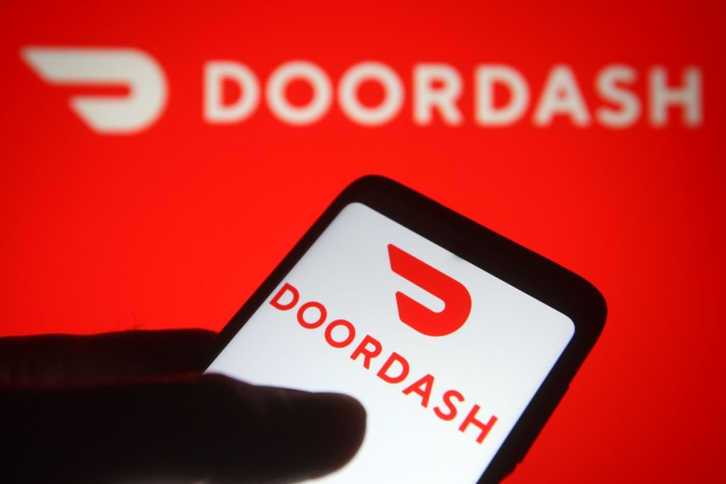 DoorDash introduces relief payments for drivers as the Iran-US war drives up gas prices DoorDash app on phone