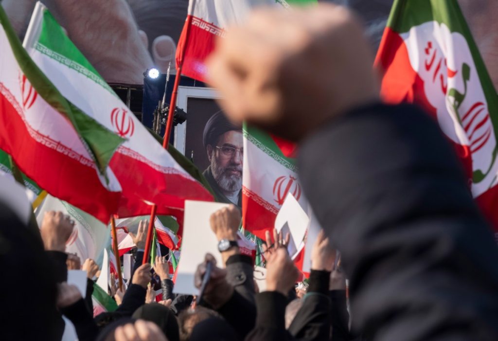Iranian men shout anti-U.S. and anti-Israeli slogans in front of a portrait of Iran's new Supreme Leader, Ayatollah Mojtaba Khamenei, the son of the late Leader Ayatollah Ali Khamenei, during a rally to pledge allegiance to Mojtaba Khamenei amid the U.S.-Israeli military campaign in Tehran, Iran, on March 9, 2026.