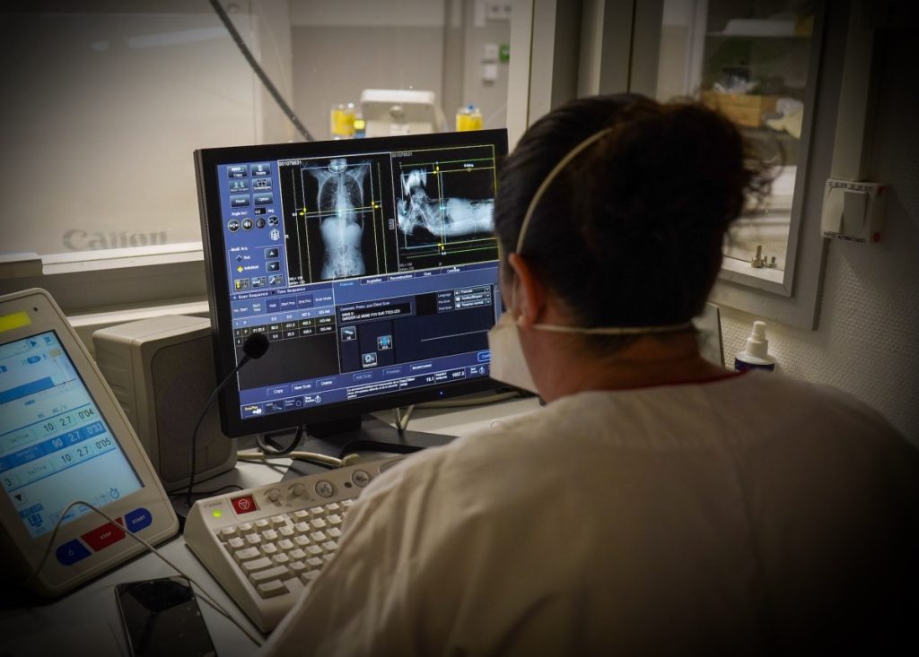 Doctor observing the images of a scanner in the emergency room of a university hospital.