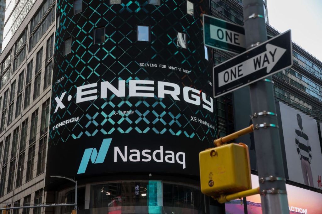 X-energy appears on a sign above the Nasdaq.