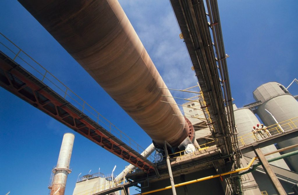 A rotary kiln at a cement plant viewed from below.
