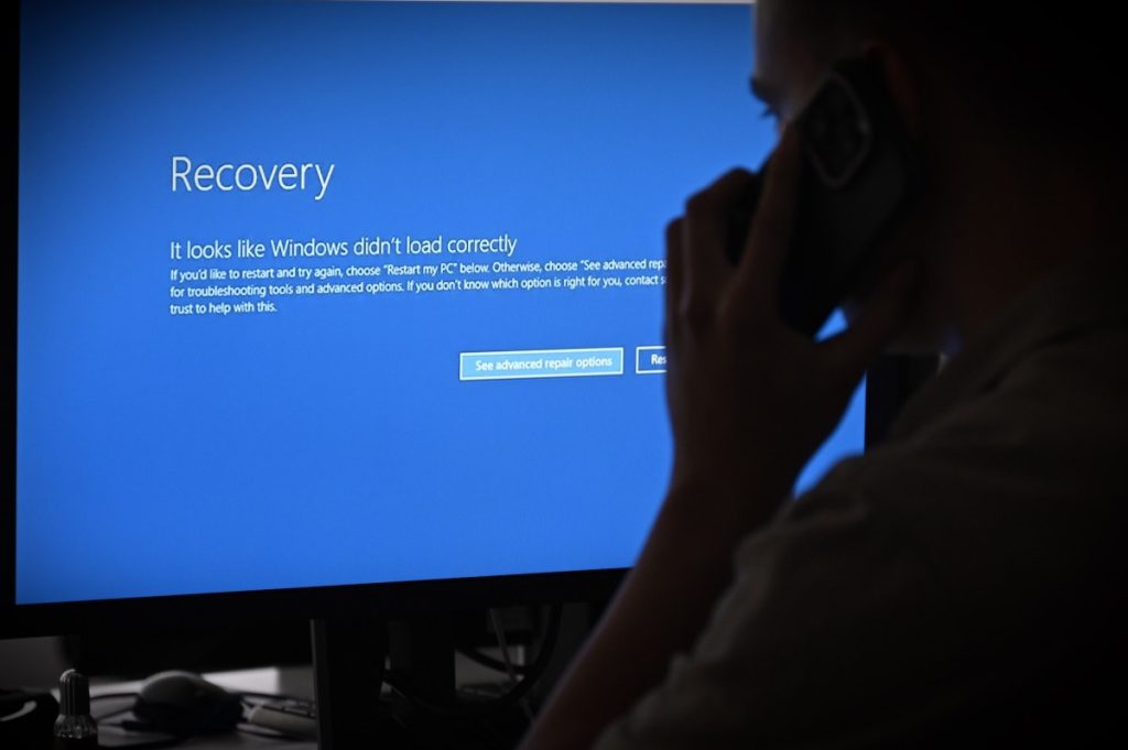 Developer of VeraCrypt encryption software says Windows users may face boot-up issues after Microsoft locked his account In this photo illustration the blue screen of death errors on computer screens are viewed due to a global communications outage.